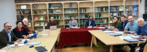 People seated at tables at the Center for Holocaust and Genocide Studies at Ramapo College 