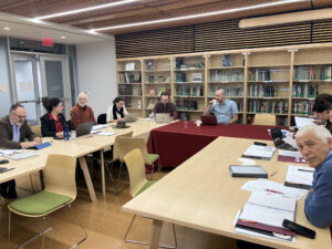 People seated at tables at the Center for Holocaust and Genocide Studies at Ramapo College 