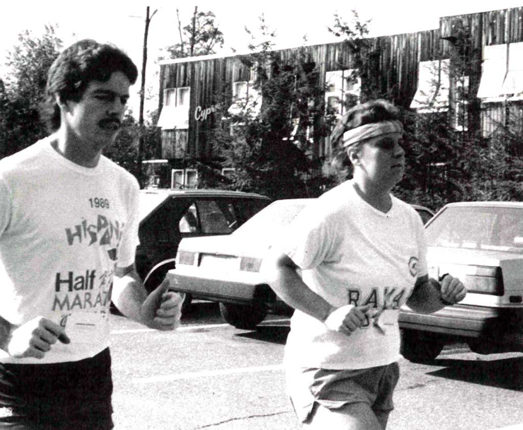 Two joggers running part the Cypress College Park Apartments at Ramapo College from 1990