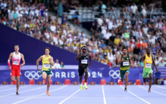 Albert Komanski of Team Poland, Calab Law of Team Australia, Joseph Fahnbulleh of Team Liberia and Wayde van Niekerk of Team South Africa and Cheickna Traore of Team Cote D'Ivoire compete during the during the Men's 200m Round 1 on day ten of the Olympic Games Paris 2024 at Stade de France on August 05, 2024 in Paris, France. (Photo by Christian Petersen/Getty Images)