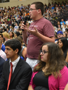 Students pose questions at Convocation.