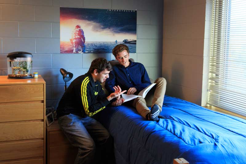 Student students in their dorm room in Mackin Hall