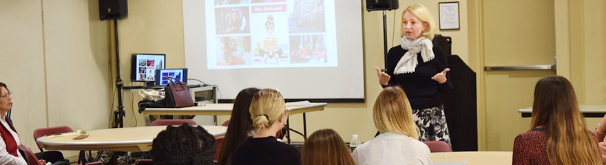 Teaching Certification - Professor talking with students about becoming a teacher