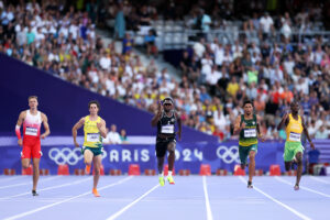 Albert Komanski of Team Poland, Calab Law of Team Australia, Joseph Fahnbulleh of Team Liberia and Wayde van Niekerk of Team South Africa and Cheickna Traore of Team Cote D'Ivoire compete during the during the Men's 200m Round 1 on day ten of the Olympic Games Paris 2024 at Stade de France on August 05, 2024 in Paris, France. (Photo by Christian Petersen/Getty Images)